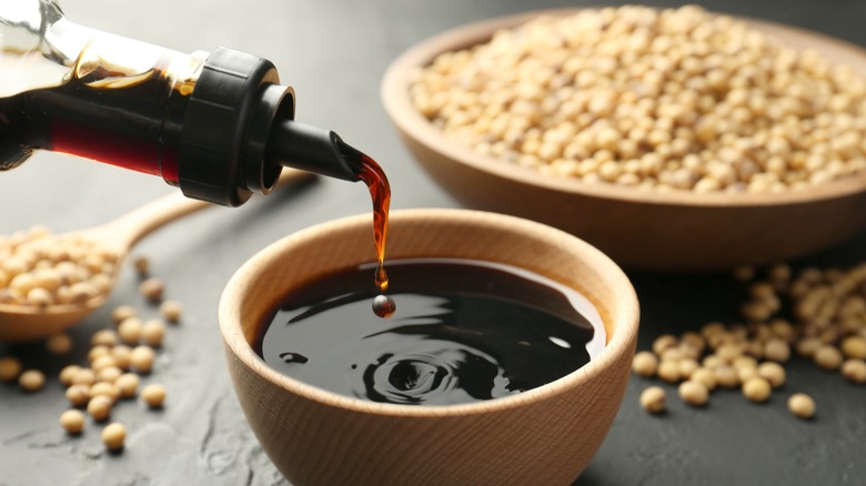Pouring soy sauce into a bowl