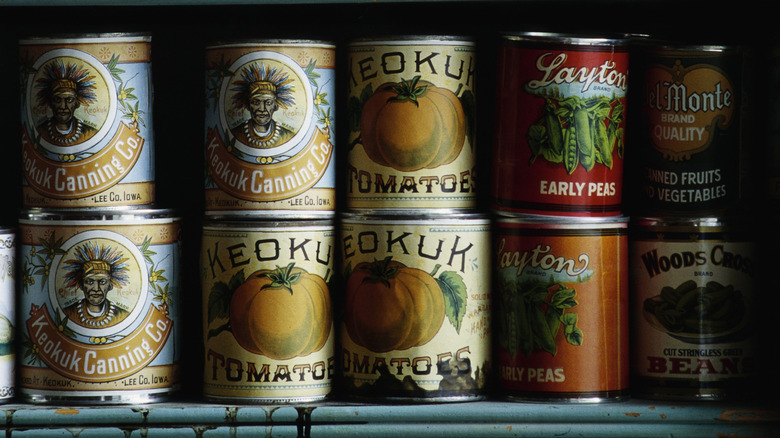 vintaged canned goods displayed on a shelf