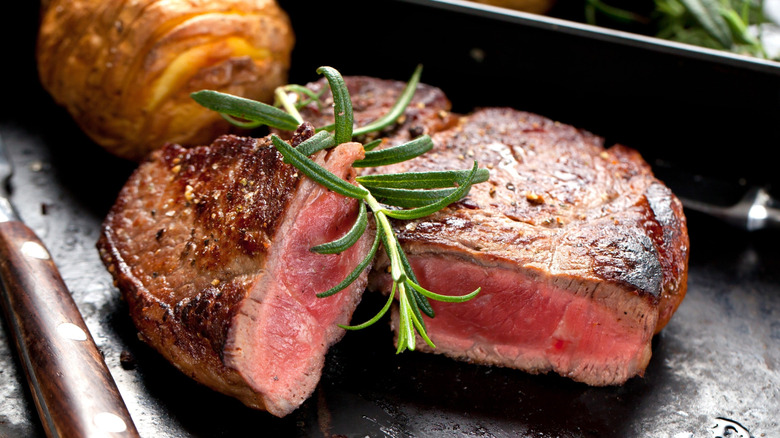 Steak topped with rosemary
