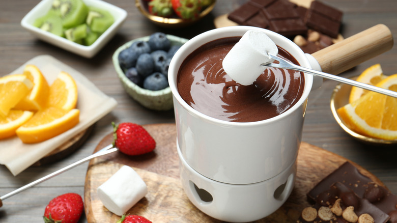 Chocolate fondue with marshmallows and fruit
