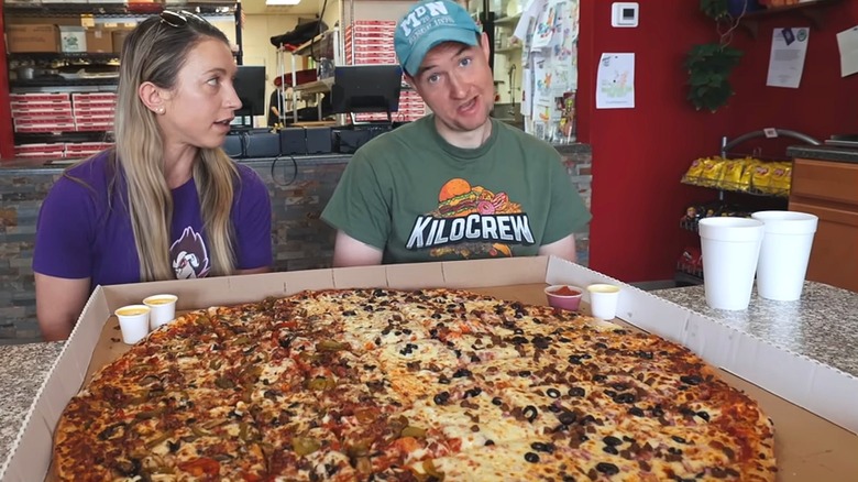Katina DeJarnett and Radim Dvořáček about to tackle The BIg One pizza