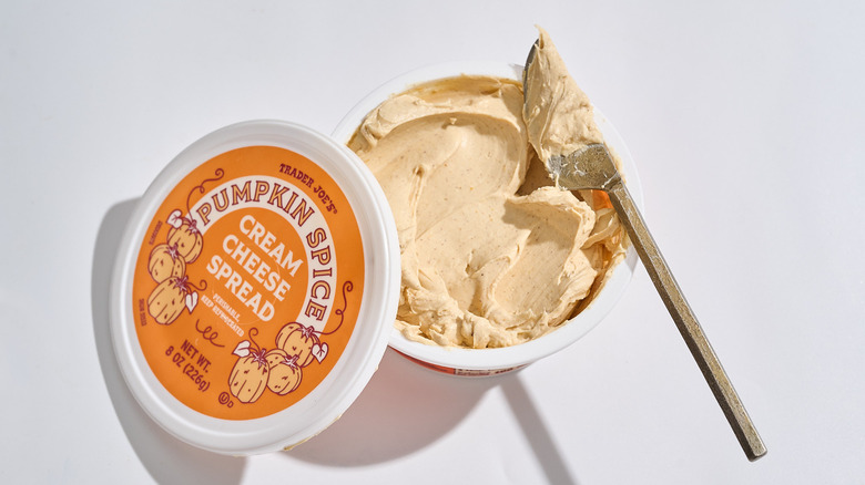 Trader Joe's Pumpkin Spice Cream Cheese Spread with a knife laid across it.