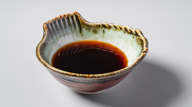 dish of ponzu on gray background
