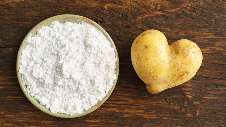 heart-shaped potato and bowl of starch