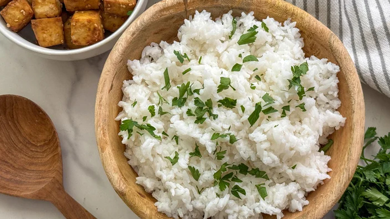 Bowl of white rice with herbs