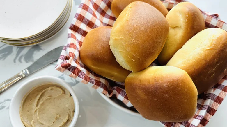 Texas Roadhouse rolls in a bin with butter