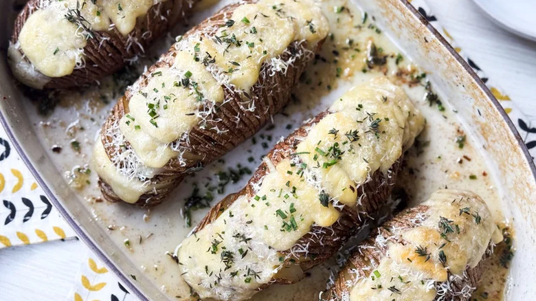 Hasselback potatoes in a dish