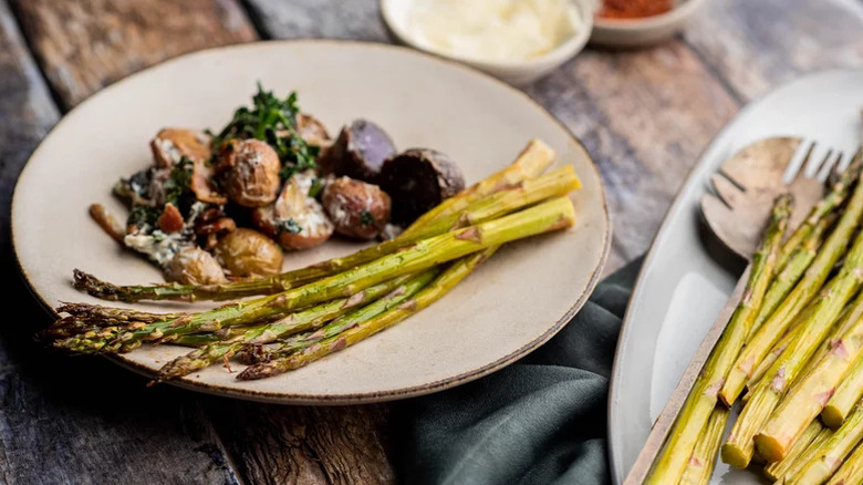 Roasted asparagus on a plate with mushrooms