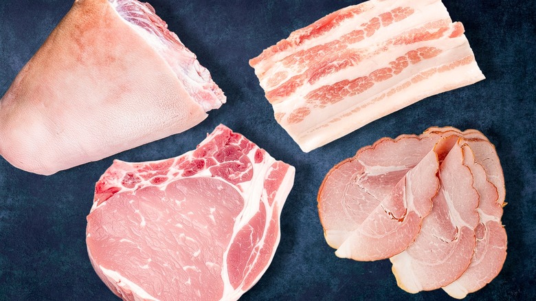 various cuts of raw pork on blank background