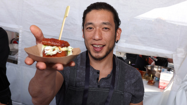 Shota Nakajima posing with food.