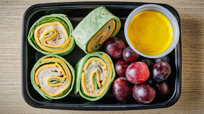 tortilla roll-ups with grapes and mustard