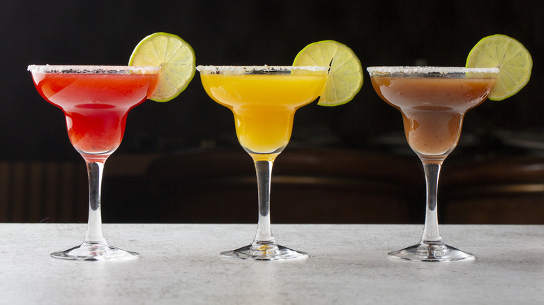 Assorted margaritas with limes