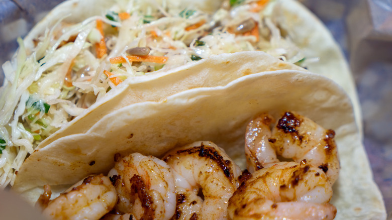 Close-up of plain grilled shrimp in a tortilla