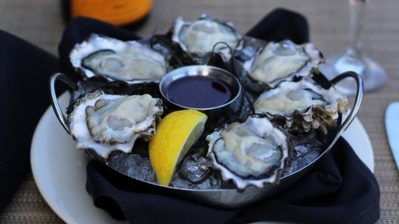 A plate of oysters on the half shell over ice served at Salty's on Alki in Seattle.
