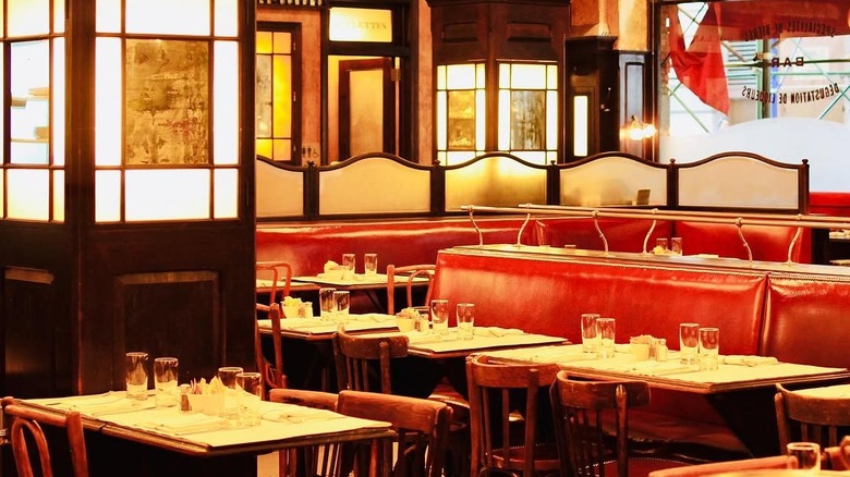 The dining room at Balthazar has red banquettes and nice lighting.