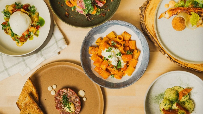 various Italian dishes on wooden table