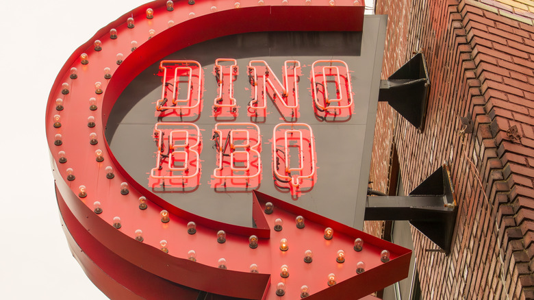 The exterior sign outside of a Dinosaur BBQ