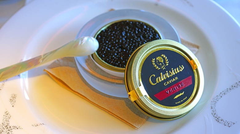 A tin of Calvisius caviar with a mother of pearl spoon