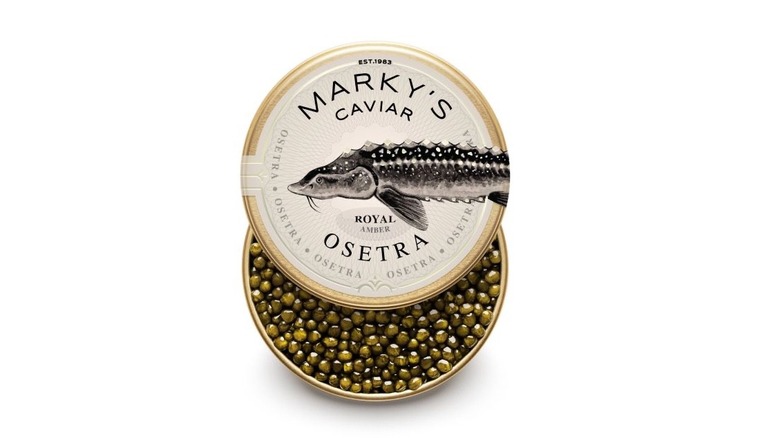 A tiny of Marky's Osetra caviar with the lid partially removed