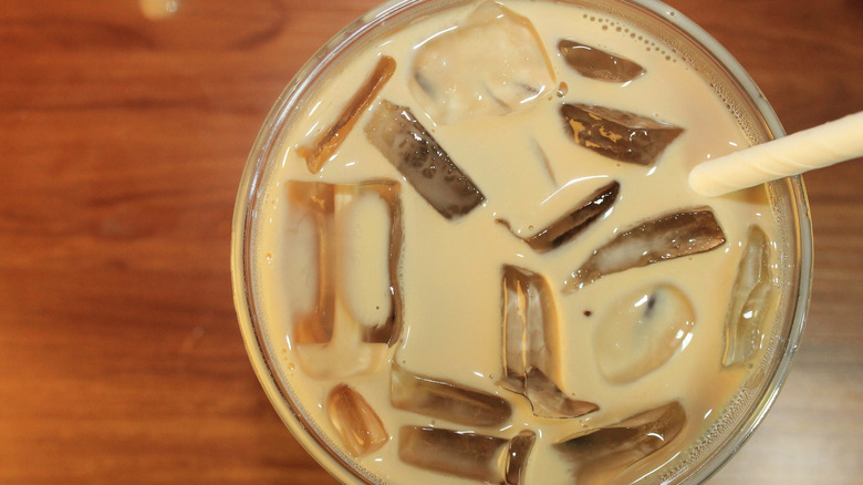Iced latte containing many ice cubes
