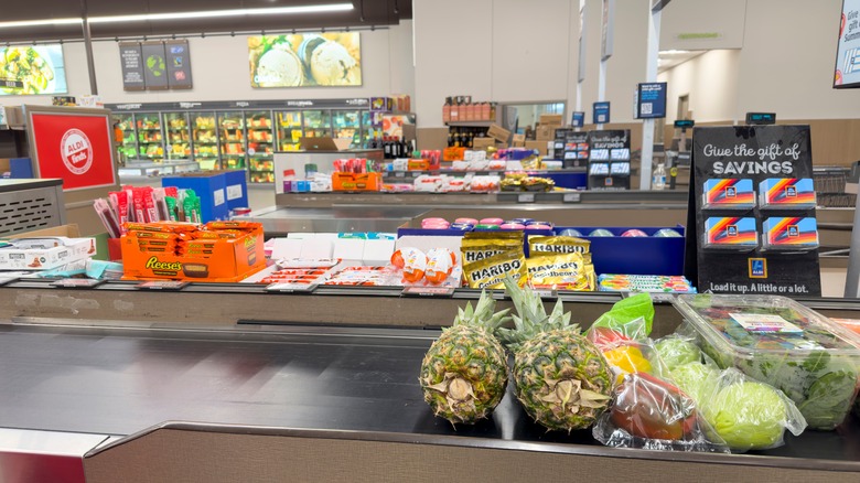 Groceries on Aldi checkout conveyor belt