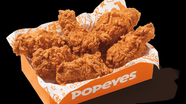 Popeye's Ghost Pepper Wings in a paper-lined box on a black background