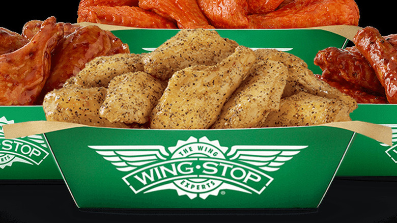 four different kinds of Wingstop Classic Wings on branded box