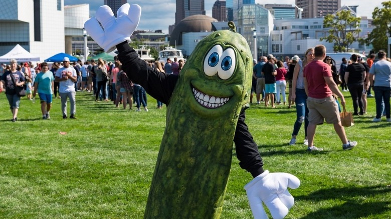 Person posing in a pickle costume