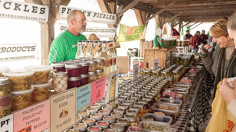 Vendor selling pickled foods to customers