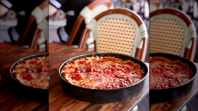Whole deep dish pizza in a pan at Labriola Ristorante