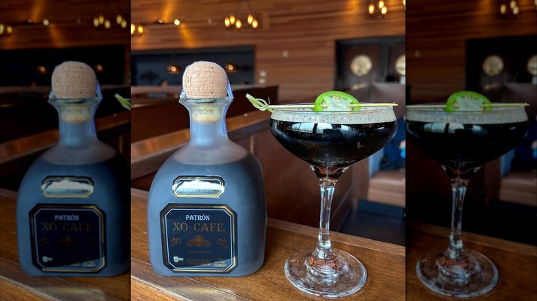 Martini with Patrón XO resting on a wooden counter in a bar setting