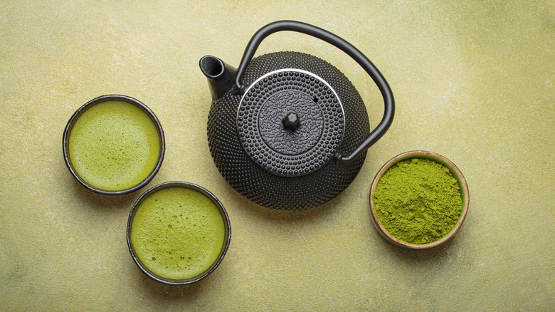 Prepared matcha with a black kettle and fresh powder