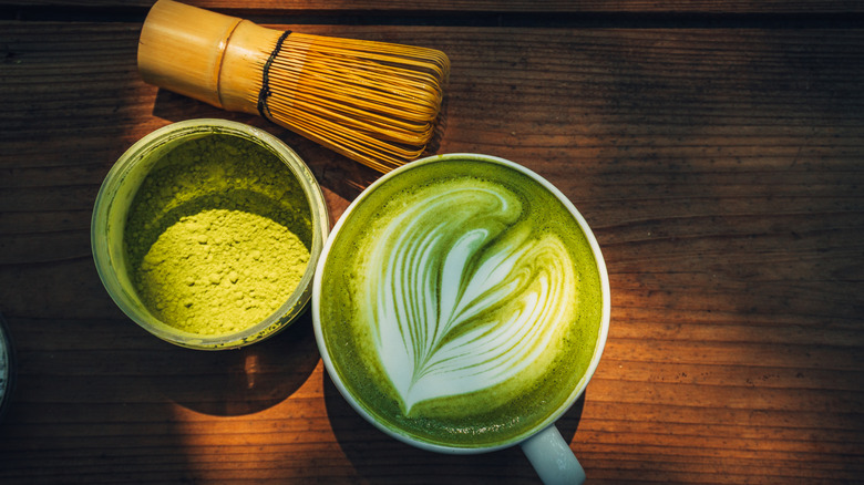 Match tea and powder on a wooden table