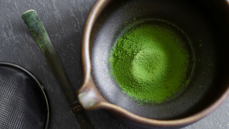 Green matcha powder before preparation
