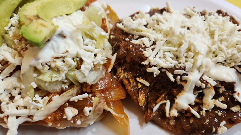 Chicken mole and chicken tinga tostadas at tostadas Coyoacan Las Originales.