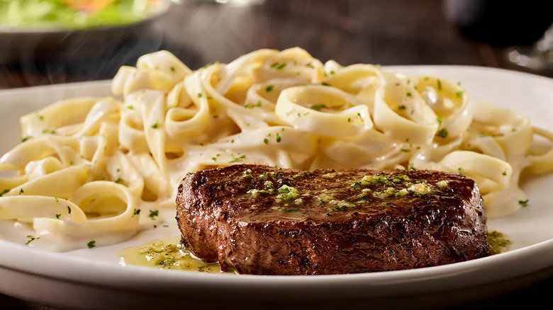 A sirloin steak with fettuccine Alfredo at Olive Garden