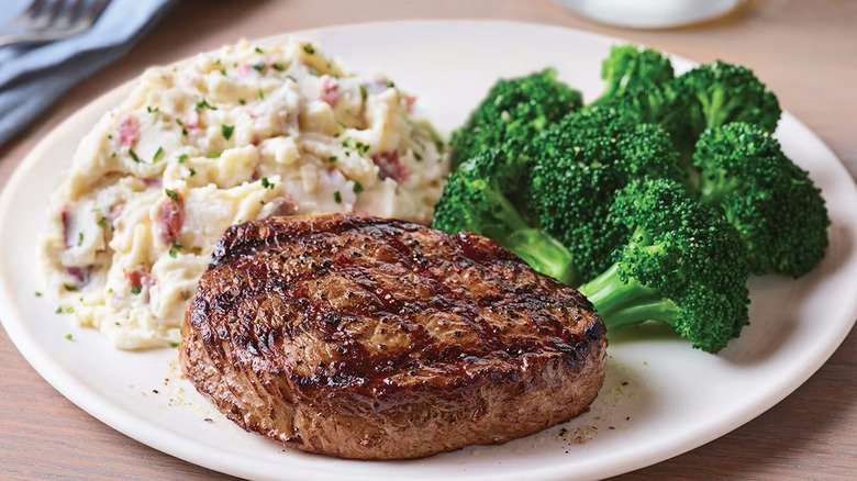 A top sirloin steak with broccoli and potatoes at Applebee's Grill & Bar