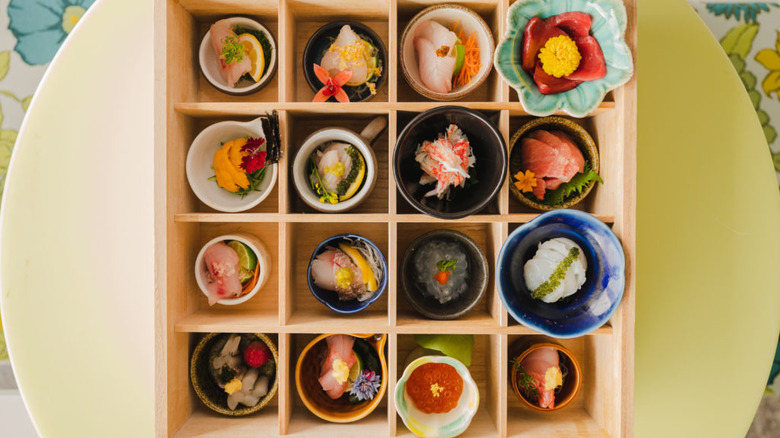 A variety of sushi in a box platter from Makoto