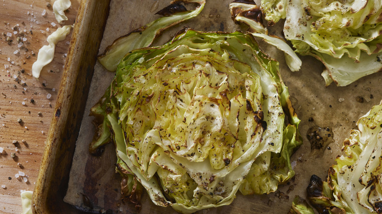Roasted cabbage steaks on a pan sheet