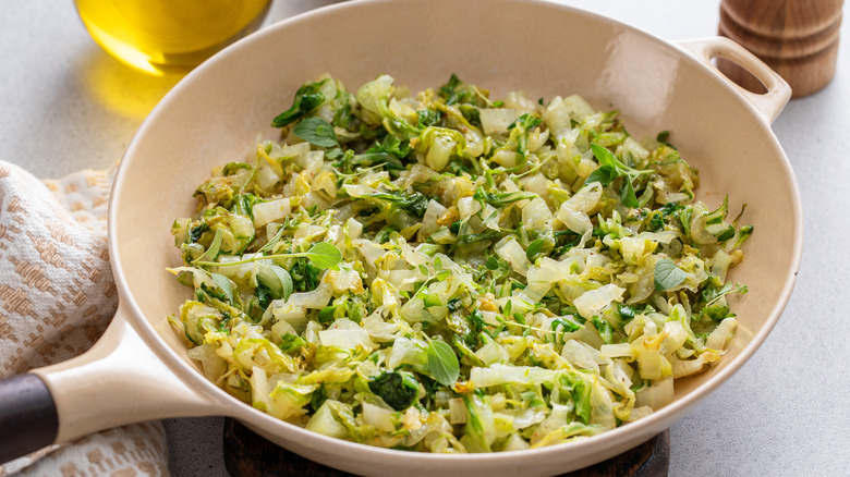 Sauteed cabbage with butter in a pan