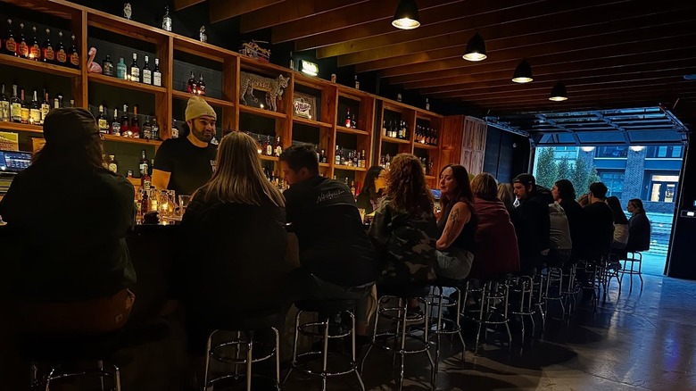 Row of people sitting at a bar