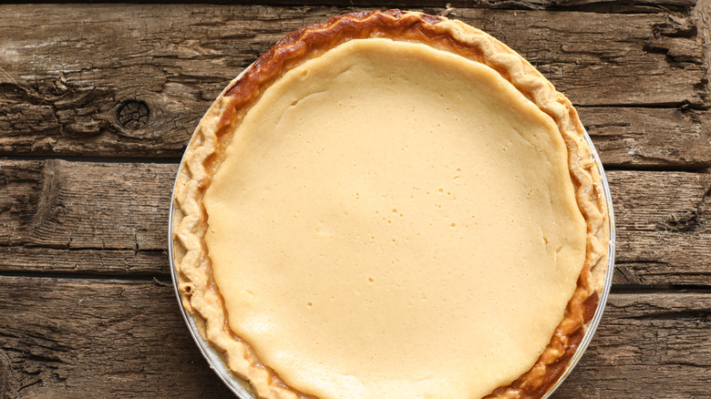 Buttermilk pie in a pie late on a wooden surface