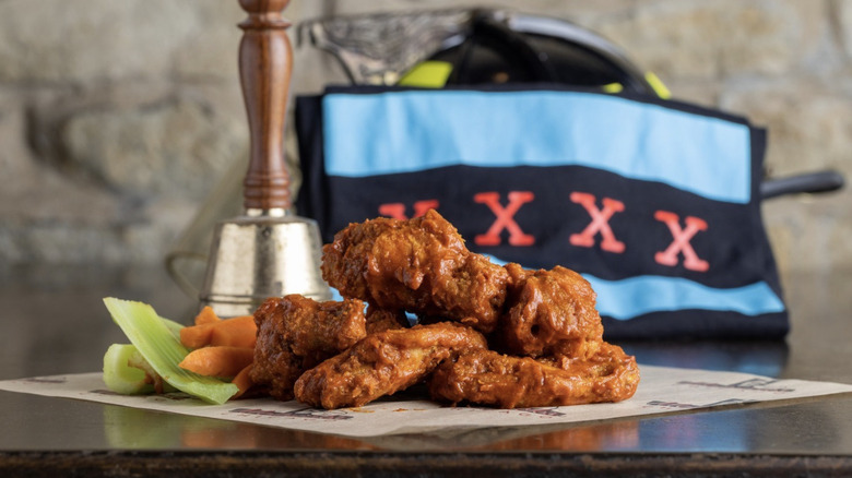 Jake Melnick's Corner Tap hot wings piled on a table