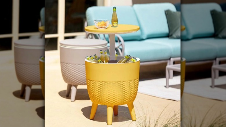 yellow cooler table filled with drinks