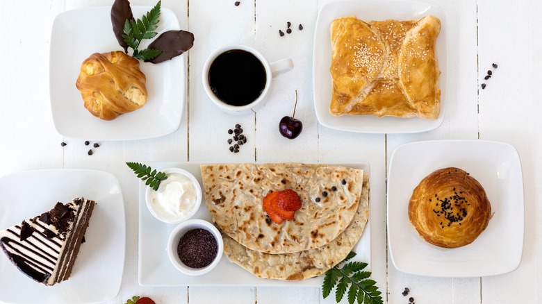 A display of various pastries and cakes from Sharbat Bakery and Café