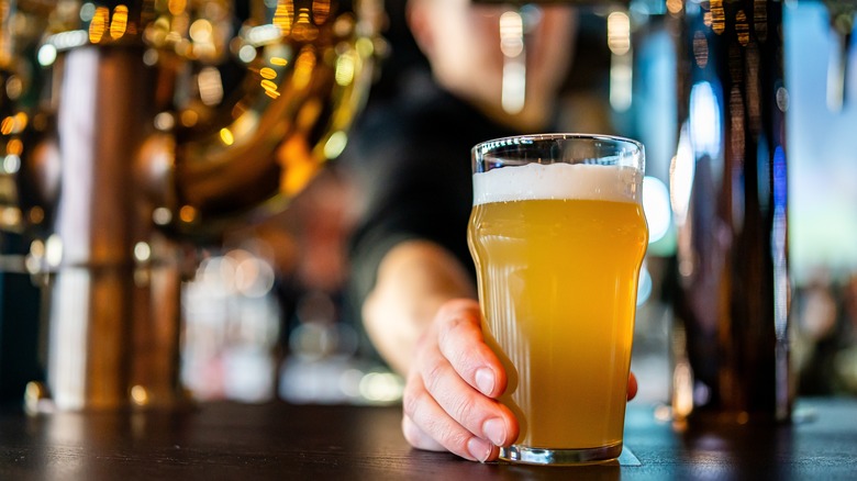pint glass filled with tap beer