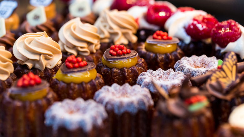 platter filled with decorated cupcakes