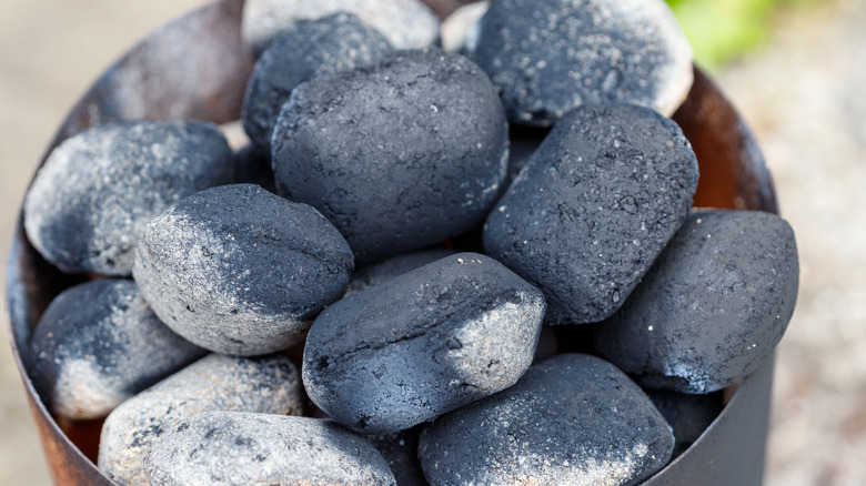 charcoal briquettes partially burned