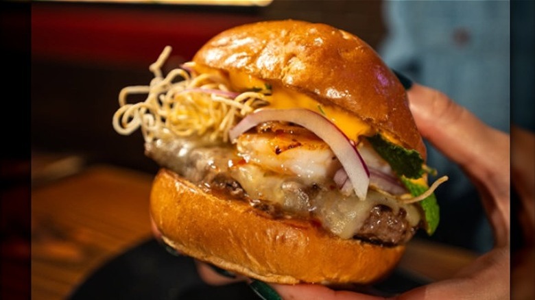 A cheeseburger loaded with toppings from Black Iron Burger