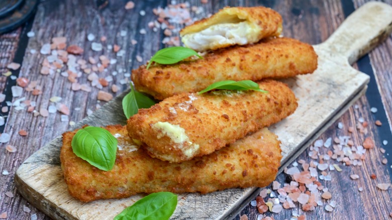fried fish sticks against a rustic background